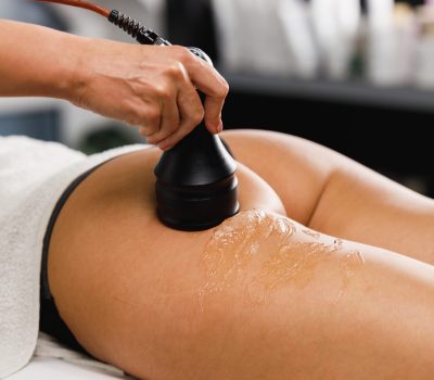 Shot of an unrecognizable woman getting an anti cellulite massage at the beauty salon. She have a vacuum treatment to fat reduction.